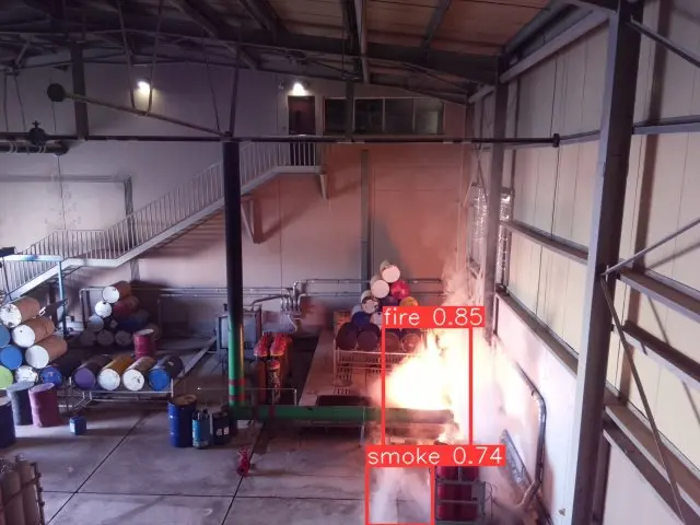 Fire and smoke detected inside an industrial building with confidence scores